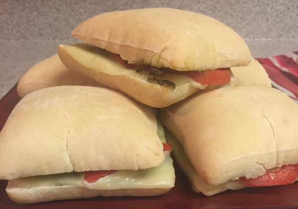 oven baked pesto sandwiches with tomato and mozzarella