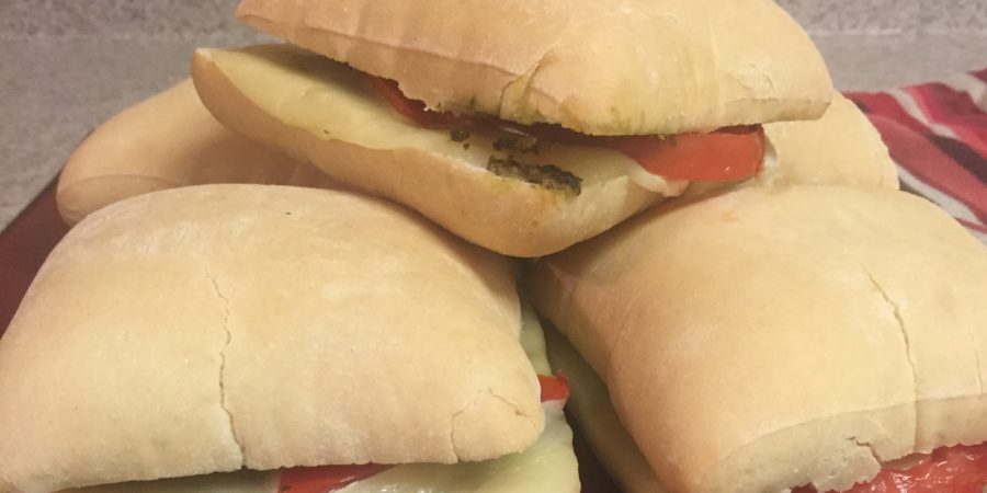 oven baked pesto sandwiches with tomato and mozzarella